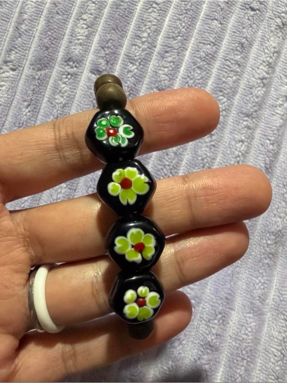 Black Floral Glass Bead Bracelet with Green Accents